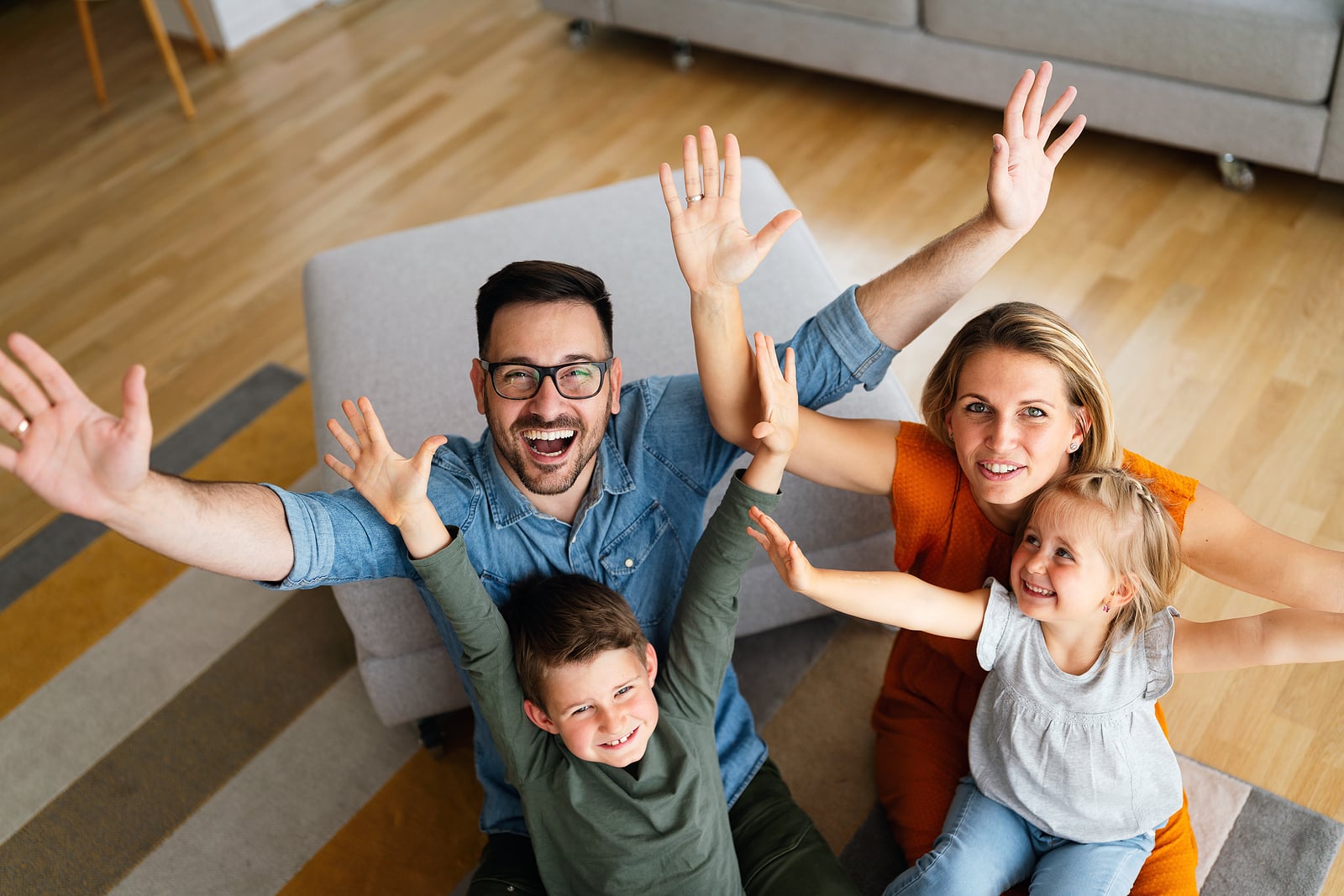 Happy family having fun time at home. Parents children love happiness concept.