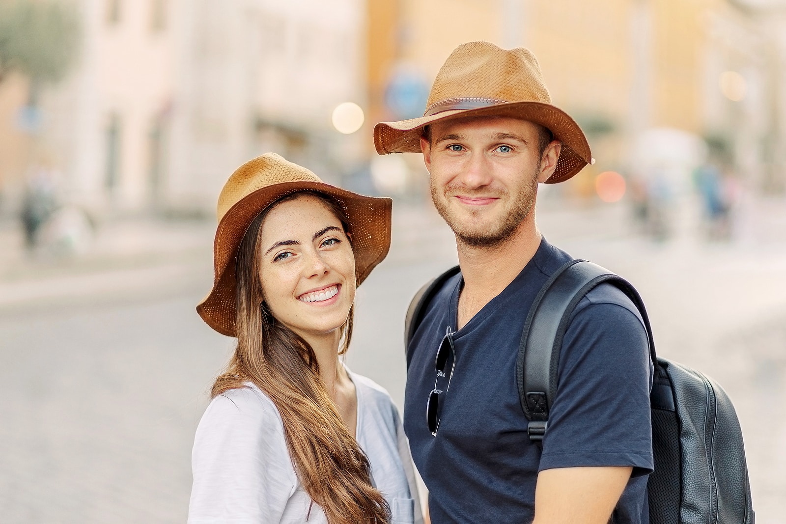 Happy Portrait of a happy young couple. A couple in love smiles and dreams. Valentines Day. cheerful young couple in casual clothes traveling the world. romance and adventure. Tourists in love