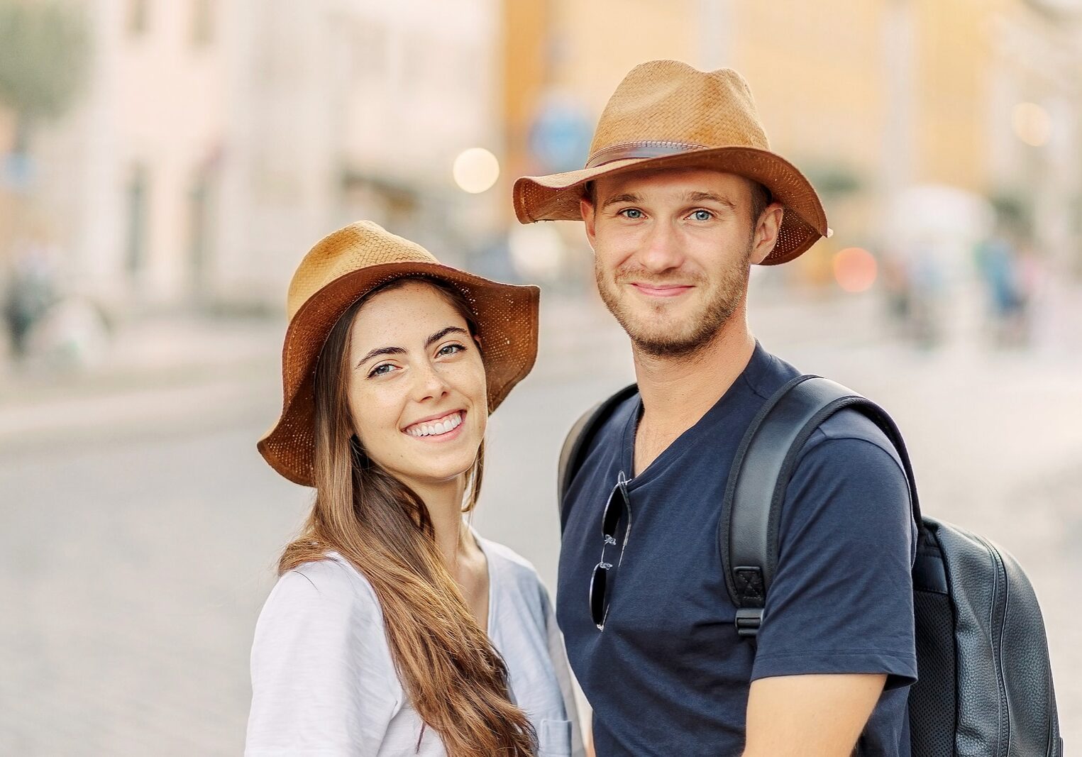 Happy Portrait of a happy young couple. A couple in love smiles and dreams. Valentines Day. cheerful young couple in casual clothes traveling the world. romance and adventure. Tourists in love