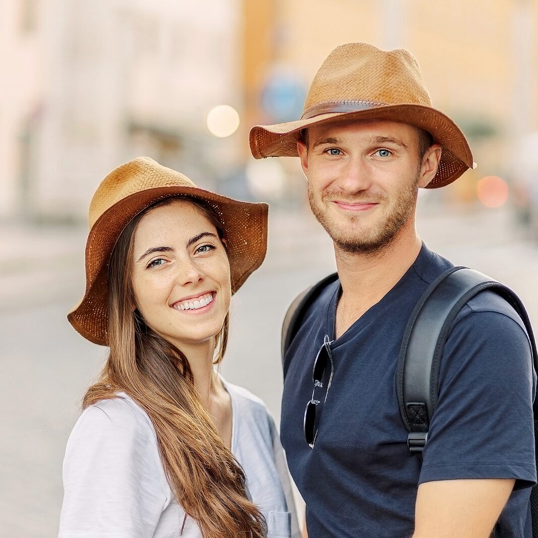 Happy Portrait Of A Happy Young Couple. A Couple In Love Smiles Happy Portrait of a happy young couple. A couple in love smiles and dreams. Valentines Day. cheerful young couple in casual clothes traveling the world. romance and adventure. Tourists in love
