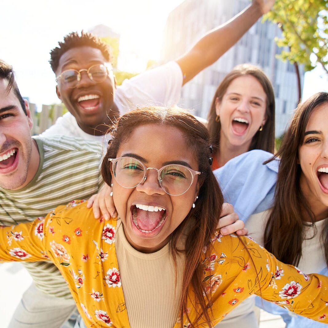 Happy Young Friends Looking Camera And Laughing Smiling Group Of Happy Young friends looking Camera and laughing Smiling Group of people having fun together outdoors
